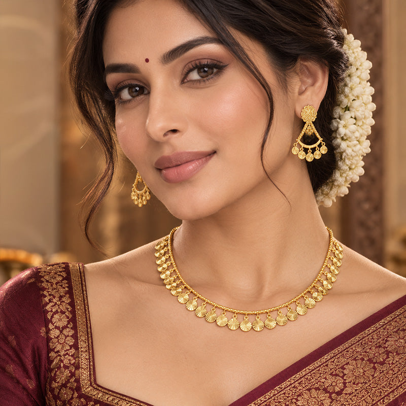 Elegant 22k yellow gold necklace and earring set with delicate running tassels