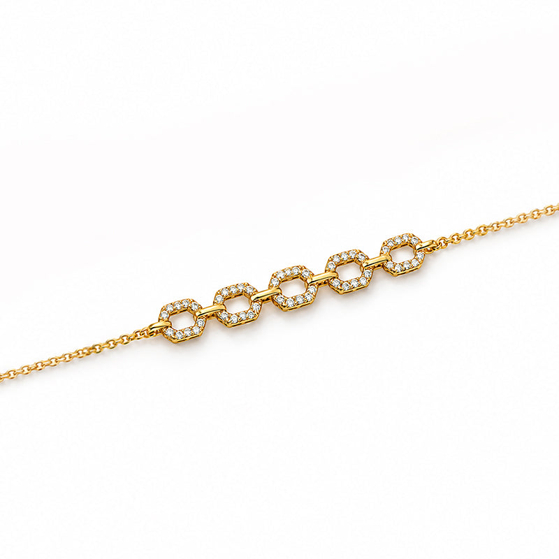 Delicate 18K yellow gold bracelet adorned with sparkling diamonds for women