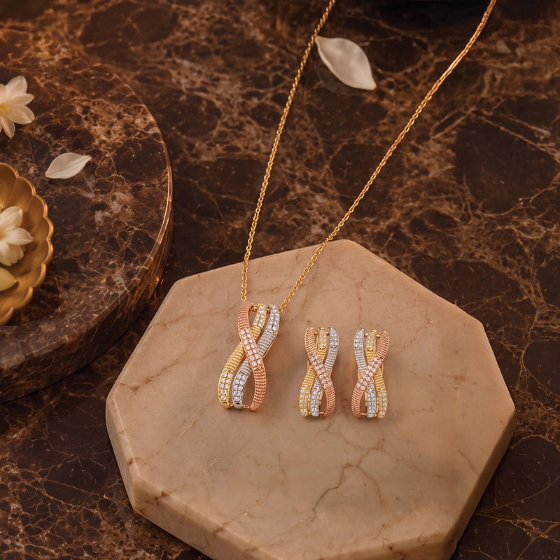Elegant tricolor gold pendant necklace with matching hoop earrings adorned with diamonds