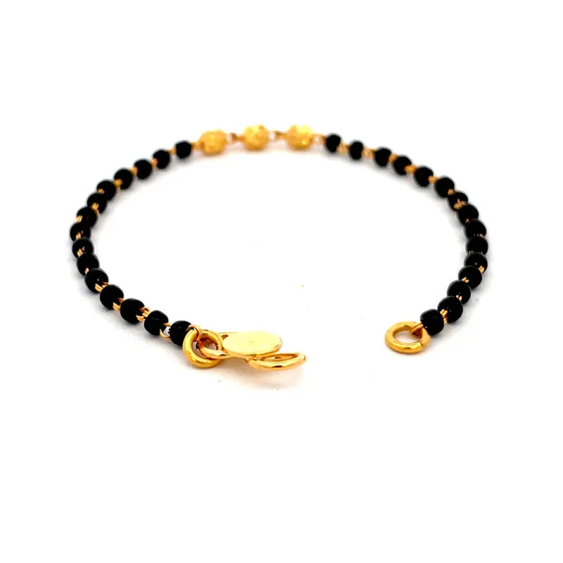 Elegant 22K Yellow Gold Baby Bracelet with Black Beads for Little Ones