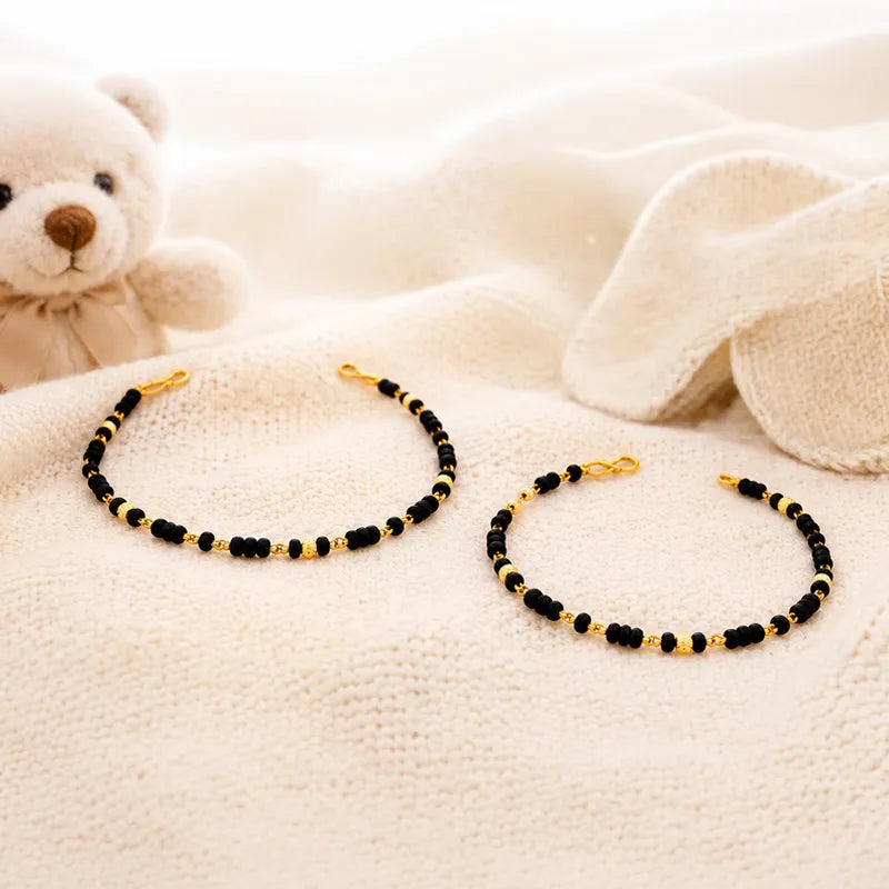 Elegant 22K Yellow Gold Baby Bracelet with Black Beads for Little Ones