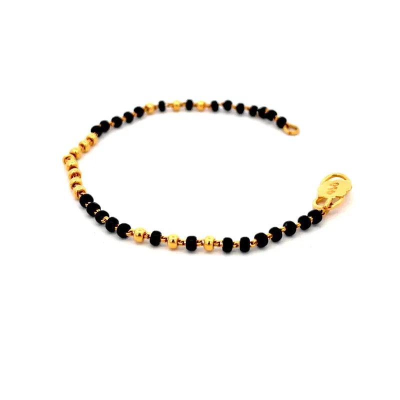 Elegant 22K Yellow Gold Baby Bracelet with Black Beads for Cherished Moments