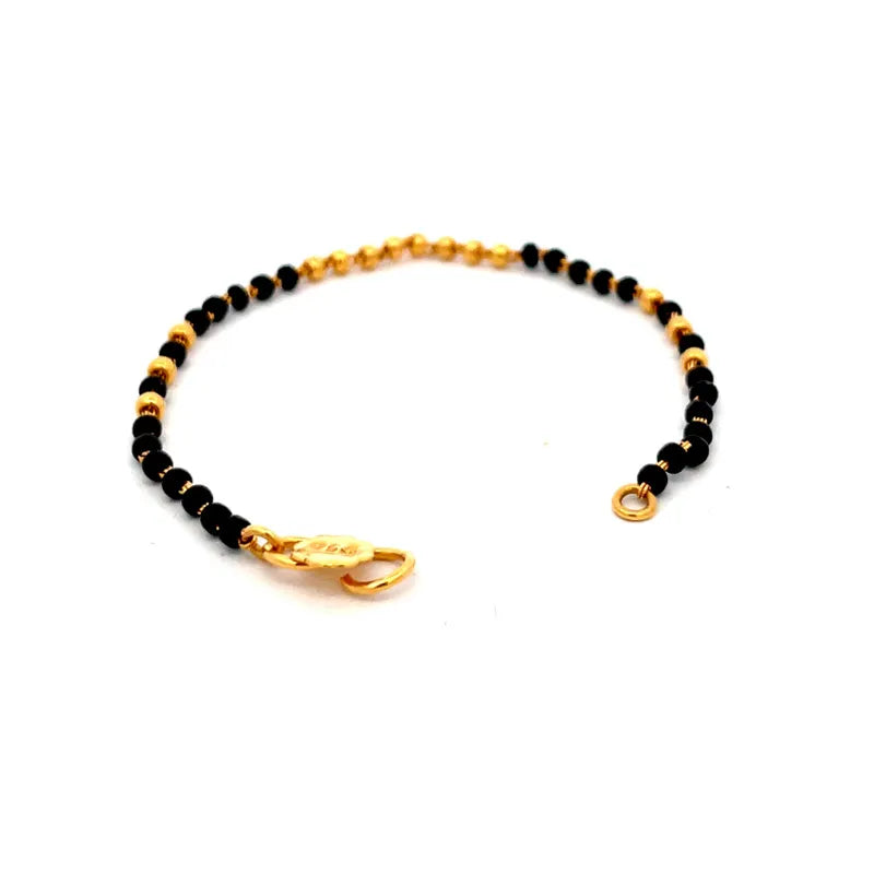 Elegant 22K Yellow Gold Baby Bracelet with Black Beads for Cherished Moments