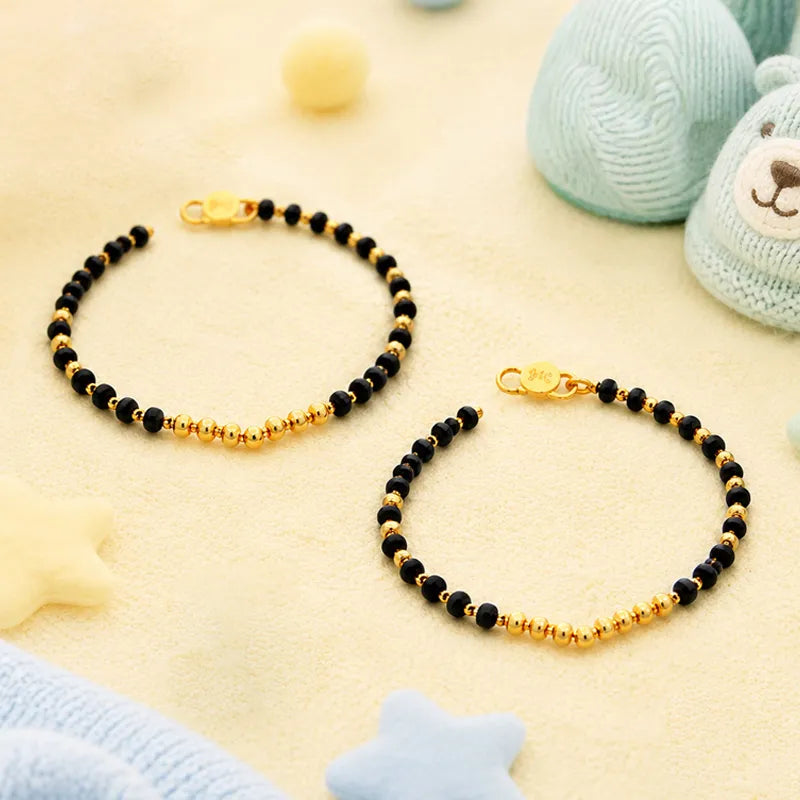 Elegant 22K Yellow Gold Baby Bracelet with Black Beads for Cherished Moments