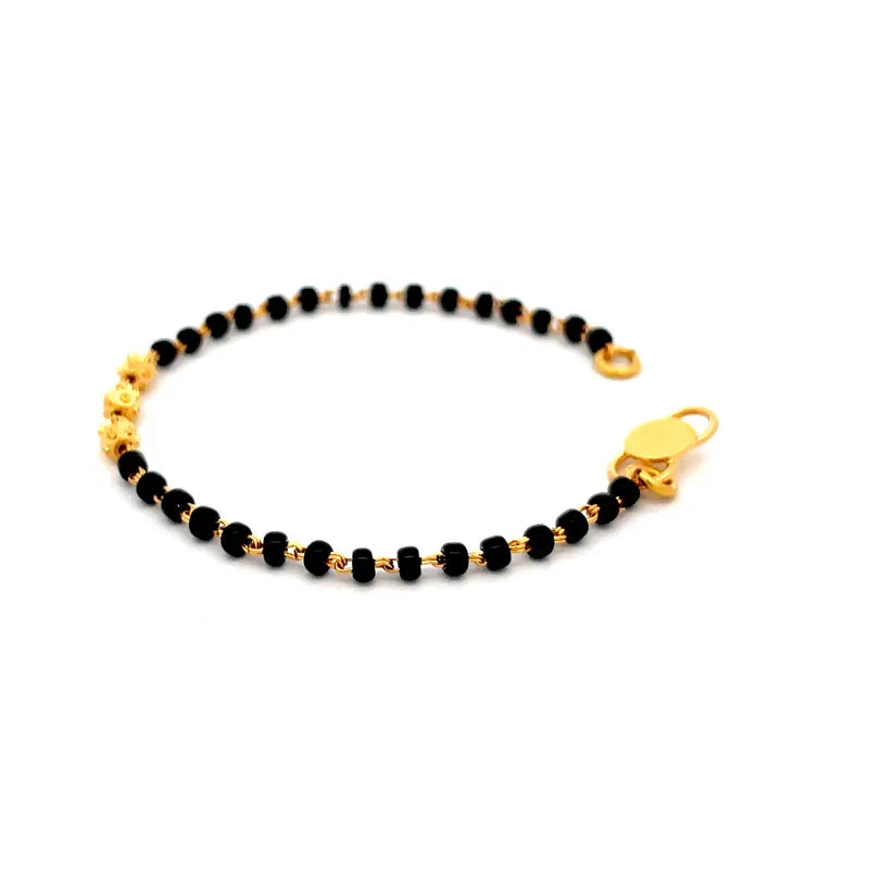 Elegant 22K Yellow Gold Baby Bracelet with Black Beads for Little Ones