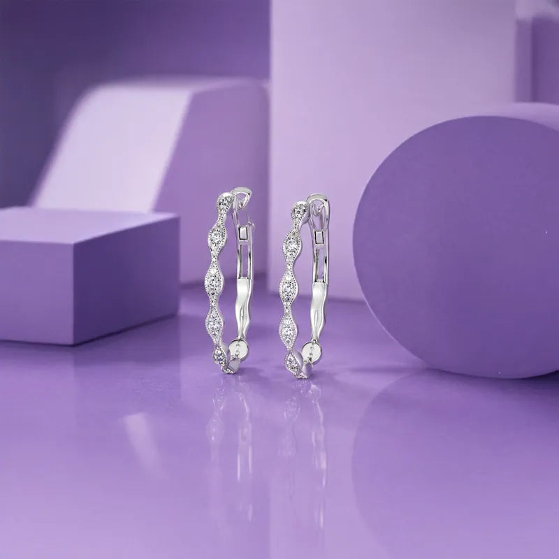 18K White Gold Diamond Swirl Huggies Earrings