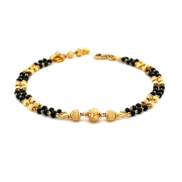 Elegant Gold and Black Bracelet - 7.25 inches
