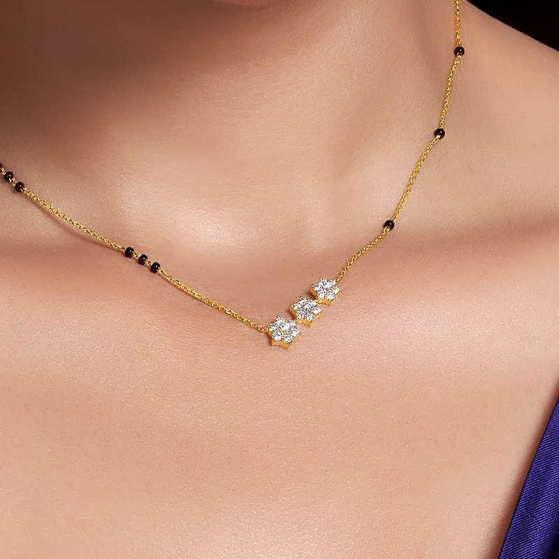 Floral Diamond Mangal Sutra in 18K yellow gold.