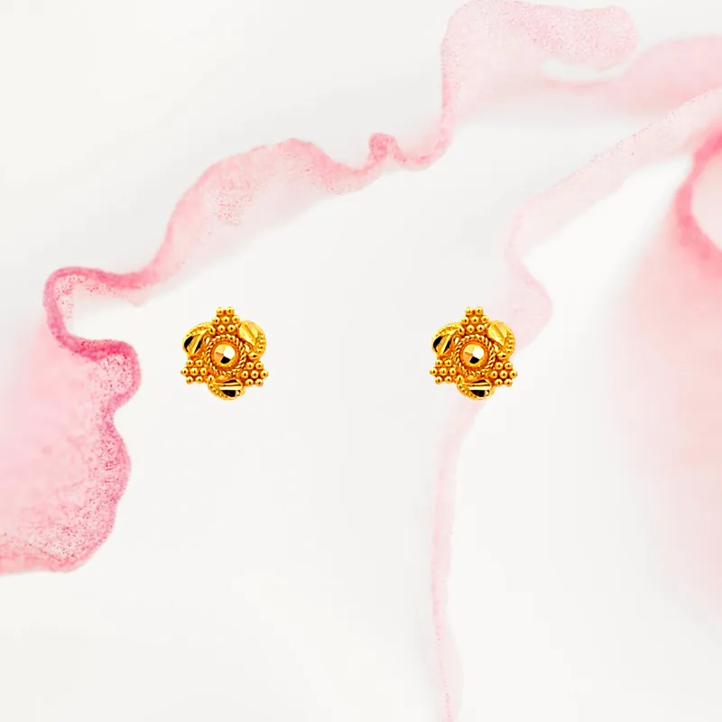 Dainty 22k yellow gold mini stud earrings with secure screw back closure
