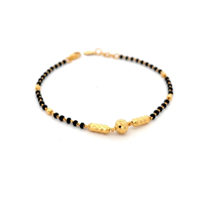 Elegant 22k yellow gold bracelet with contrasting black beads for a stylish look
