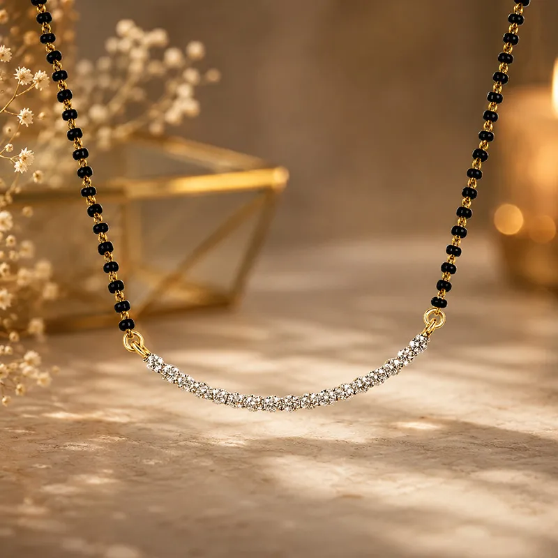 Elegant 18K gold mangalsutra with sparkling diamonds and black beads